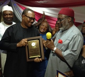 The Former Governor of Anambra State, Mr. Peter Obi (left), being presented by the President of Ohaneze, Chief G. Nnachi Enwo-Igariweya(right) , the Exemplary Leadership Ward from Ndigboamaka at the Golden Gate Restaurant, Lagos on Sunday
