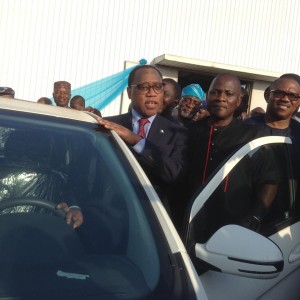 caption for the pic The MD of Innoson Vehicles Manufacturing Company, Nnewi, Dr. Innocent Chukwuma( middle), with the former Governor of Anambra State, Mr. Peter Obi (right) and the Hon. Minister of Trade and Investment, Dr. Olusegun Aganga( left), during the unveiling of new cars by Innoson Group, IVM Fox, UMU and UZO at the company’s premises at Nnewi