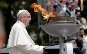 Pope Francis speaks next to a "reconciliation flame" during a ceremony at the presidential palace in Bogota, Colombia, Thursday, Sept. 7, 2017. Pope Francis opens the first full day in his Colombia visit on Thursday with messages to political leaders and citizens alike encouraging all to rally behind a peace process seeking an end for Latin America’s longest-running conflict and to address the inequalities that fueled it.