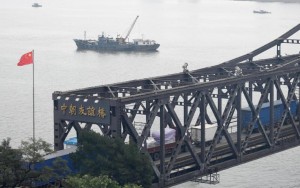 (1 of 1) Trucks transport goods to North Korea through the Friendship Bridge linking China and North Korea, as seen from Dandong in northeastern China's Liaoning Province. While condemning North Korea over its latest nuclear test, the leaders of Russia and South Korea seemed far apart on the issue of stepping up sanctions against the country. (Minoru Iwasaki/Kyodo News via AP)