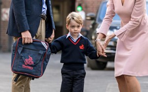  Britain's Prince William accompanies Prince George as he is met by Helen Haslem - the head of the lower school on arrival for his first day of school at Thomas's school in Battersea, London, Thursday, Sept. 7, 2017. Prince William's pregnant wife Kate was too ill with morning sickness Thursday to take young Prince George to his first day of school. (Richard Pohle/Pool Photo via AP)